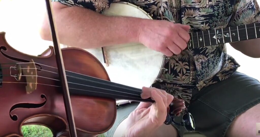 closeup of a fiddle and banjo duet